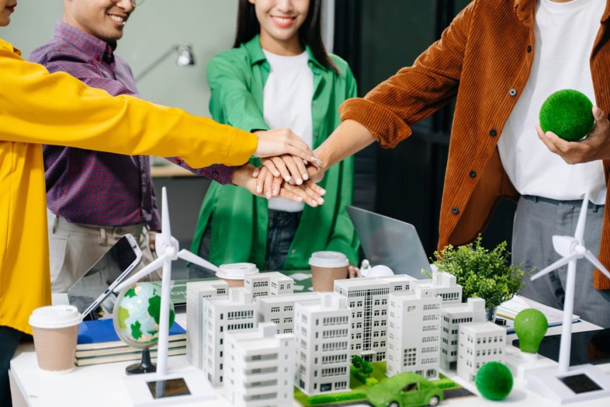 Group of diverse multiethnic businesspeople standing neare table